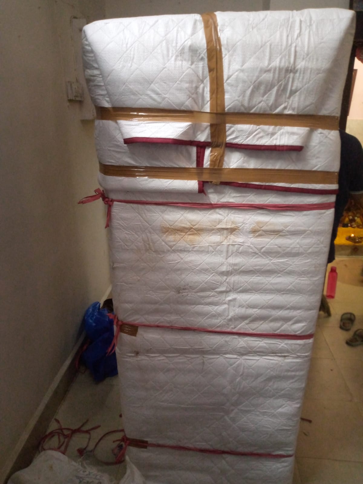 Team wrapping fridge with bubble wrap in Rohini